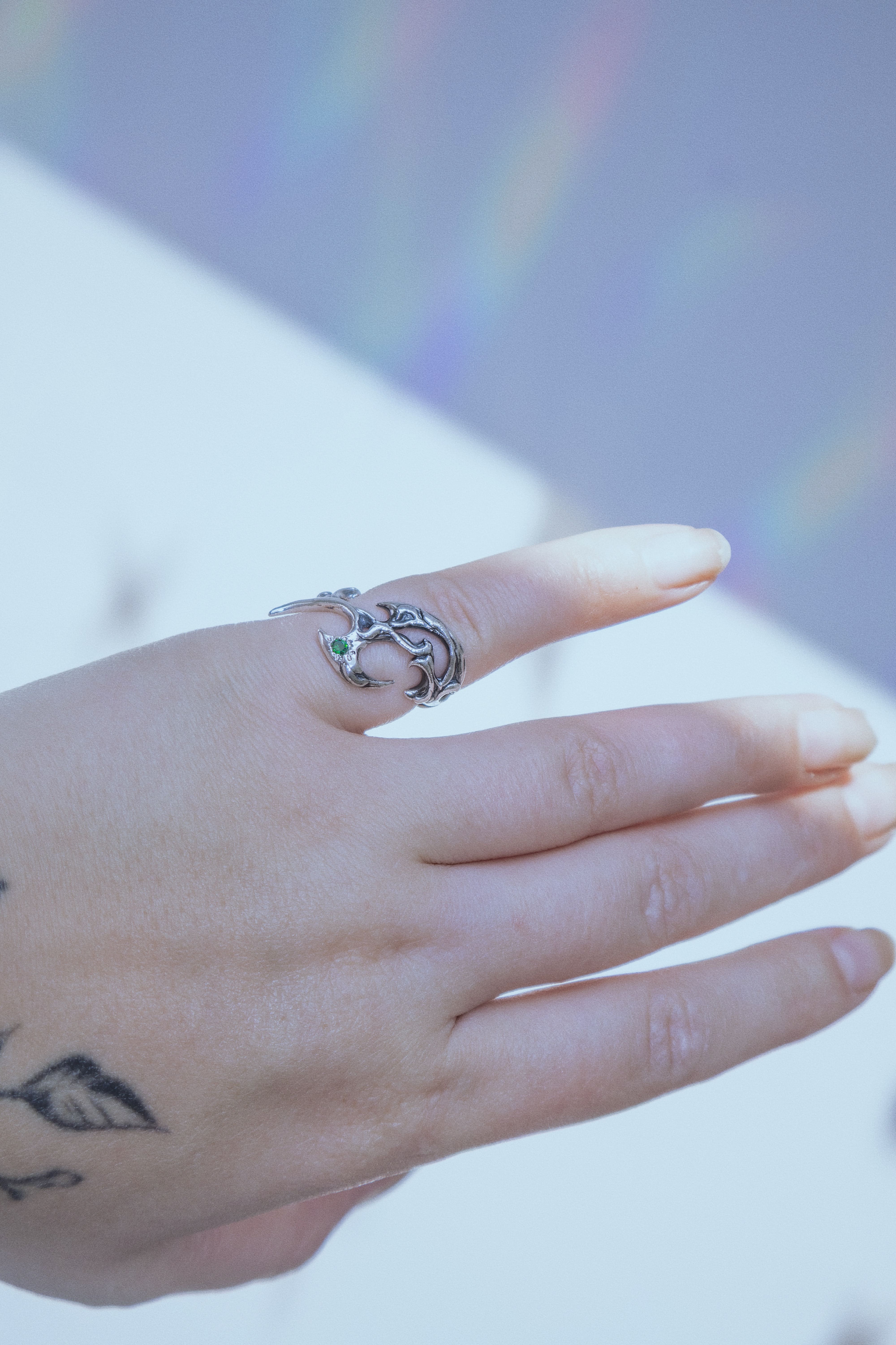 Tribal ring with green cubic zirconia