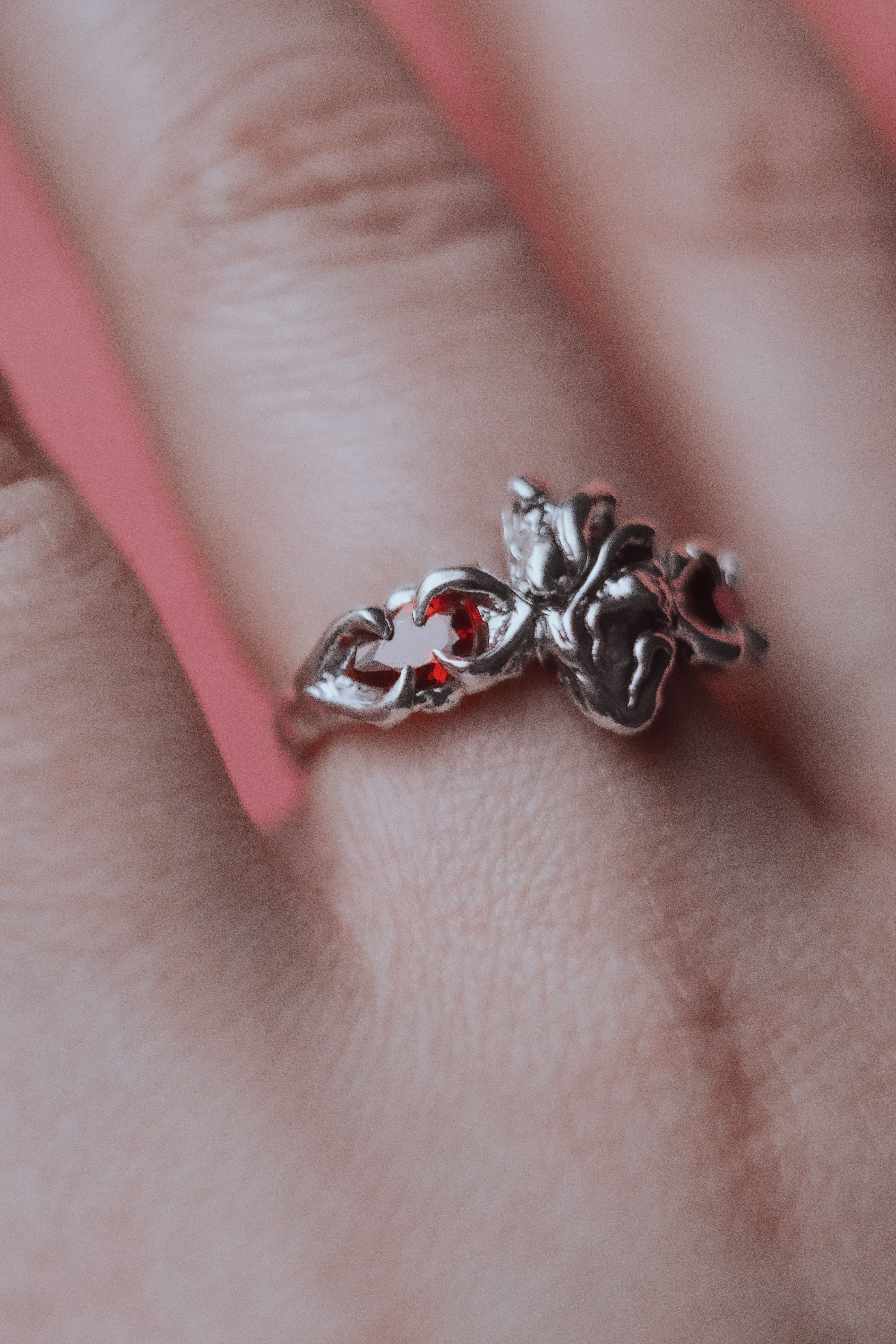 Ring with an anatomical heart and stones