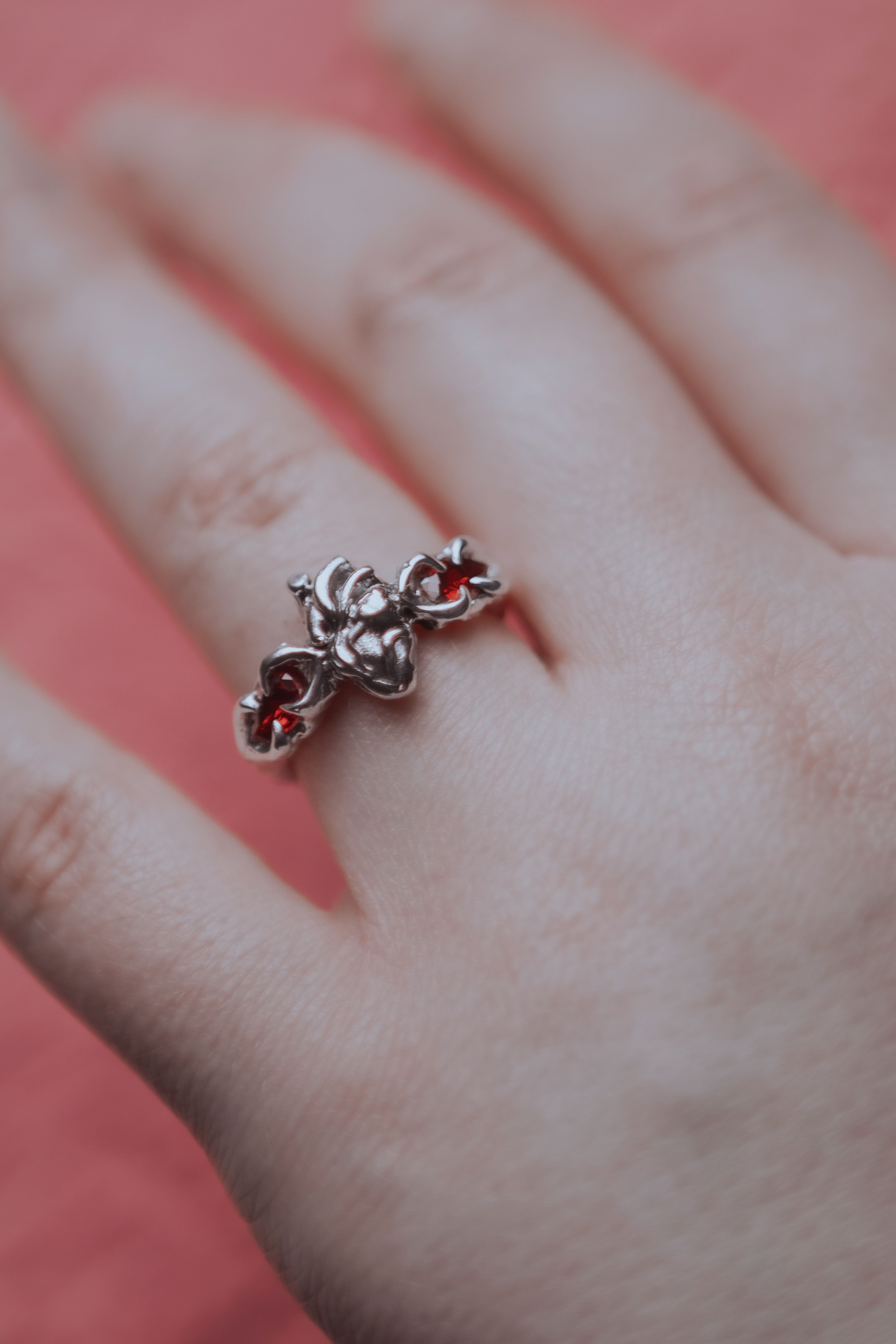 Ring with an anatomical heart and stones