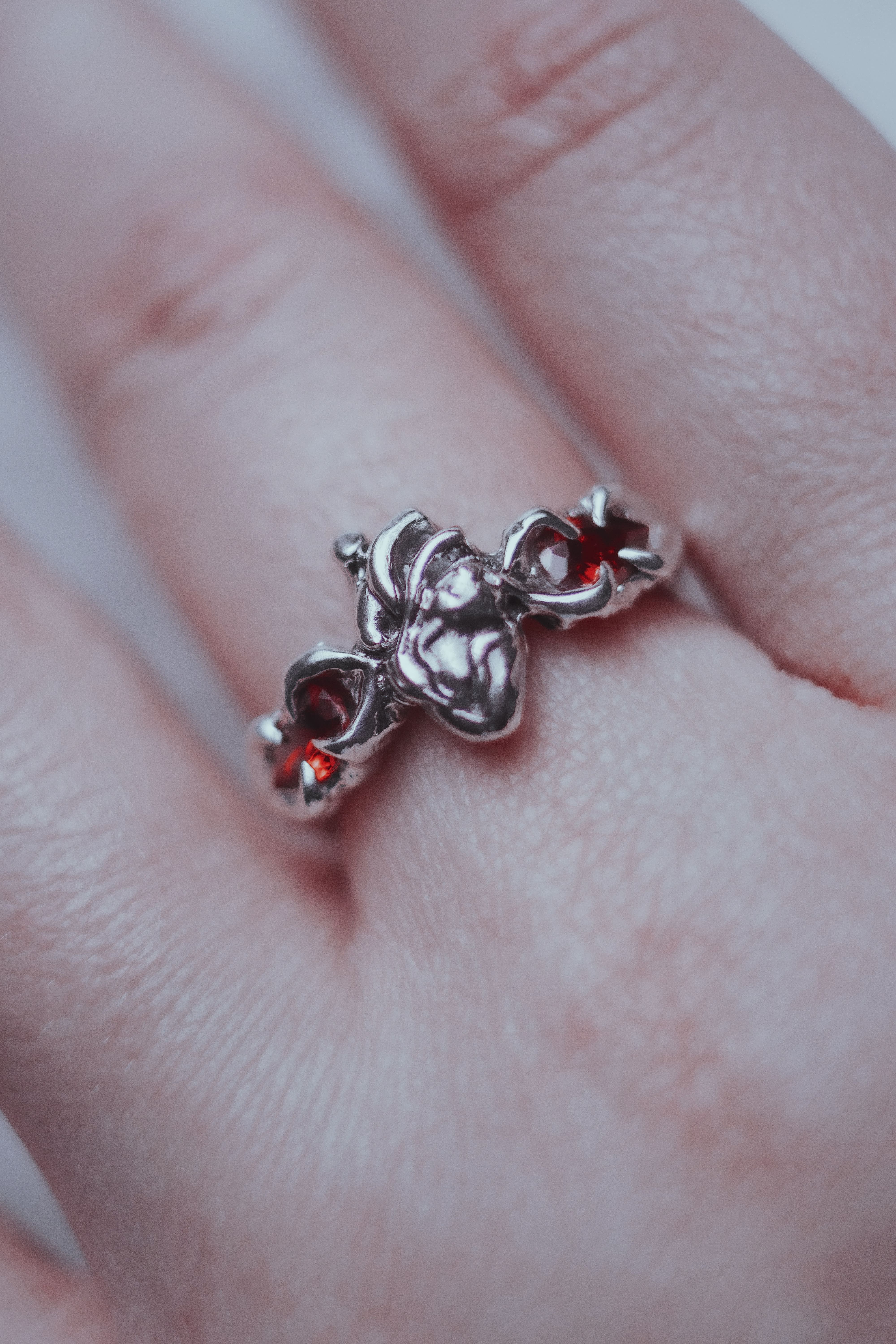 Ring with an anatomical heart and stones