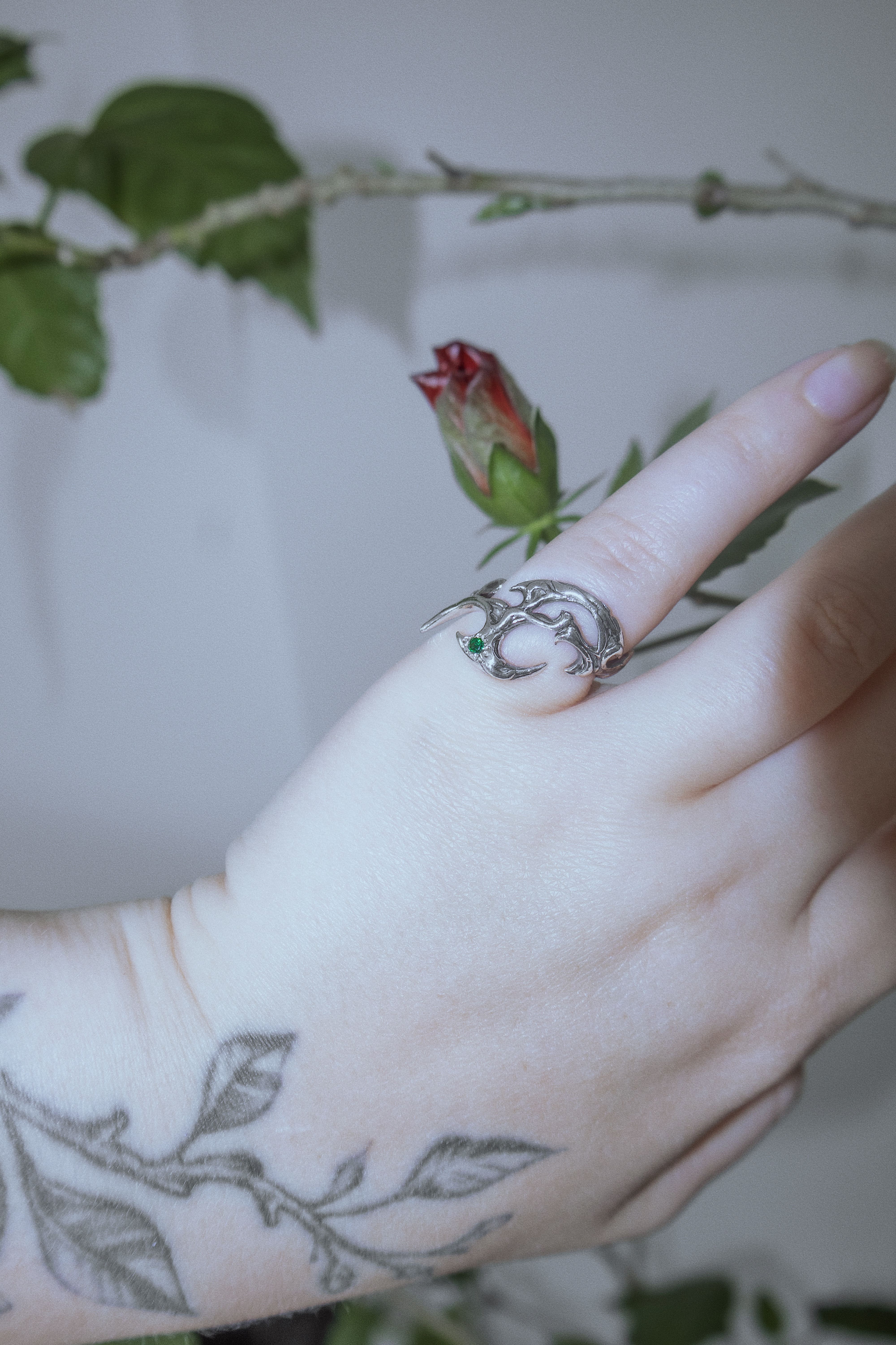 Tribal ring with green cubic zirconia