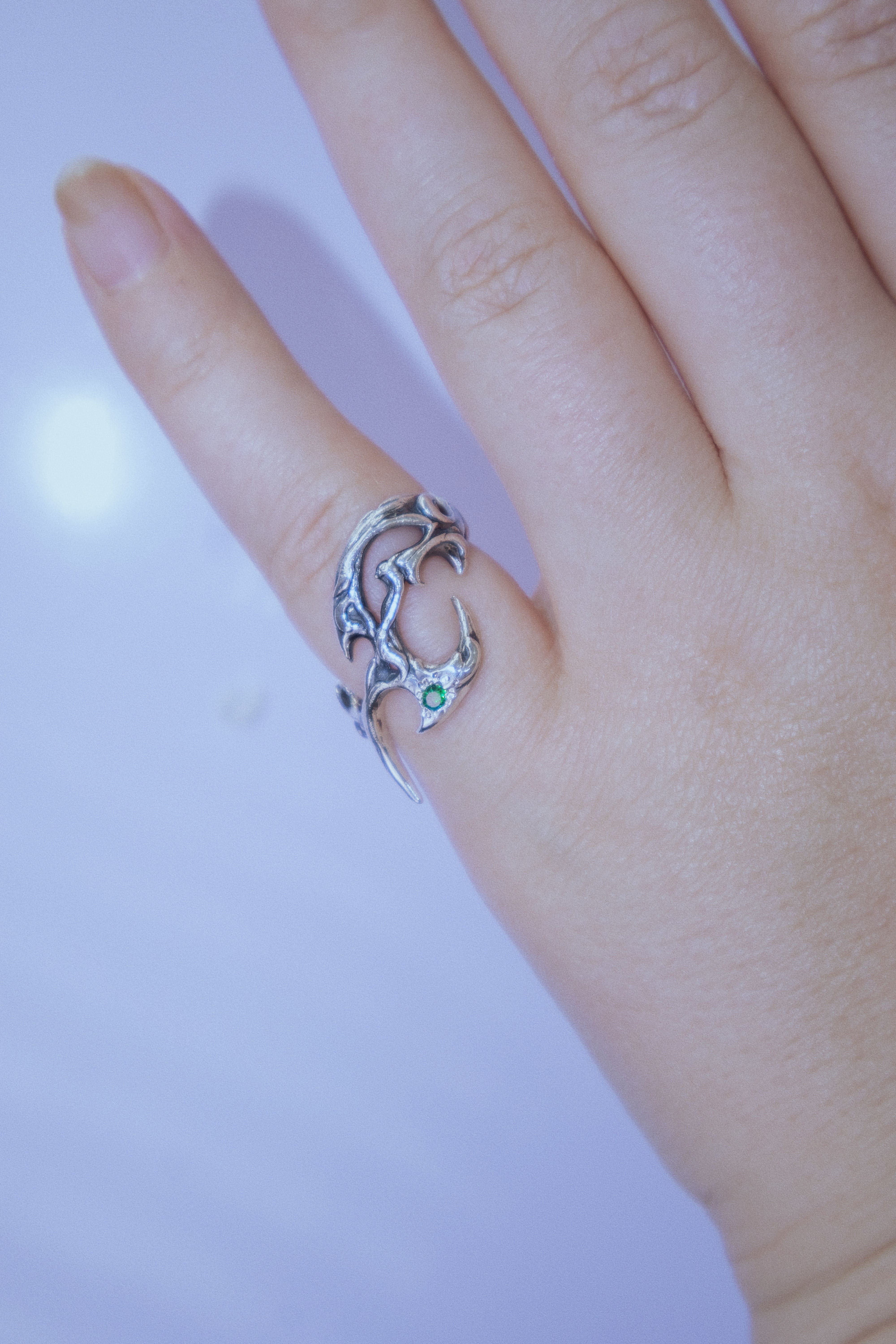 Tribal ring with green cubic zirconia
