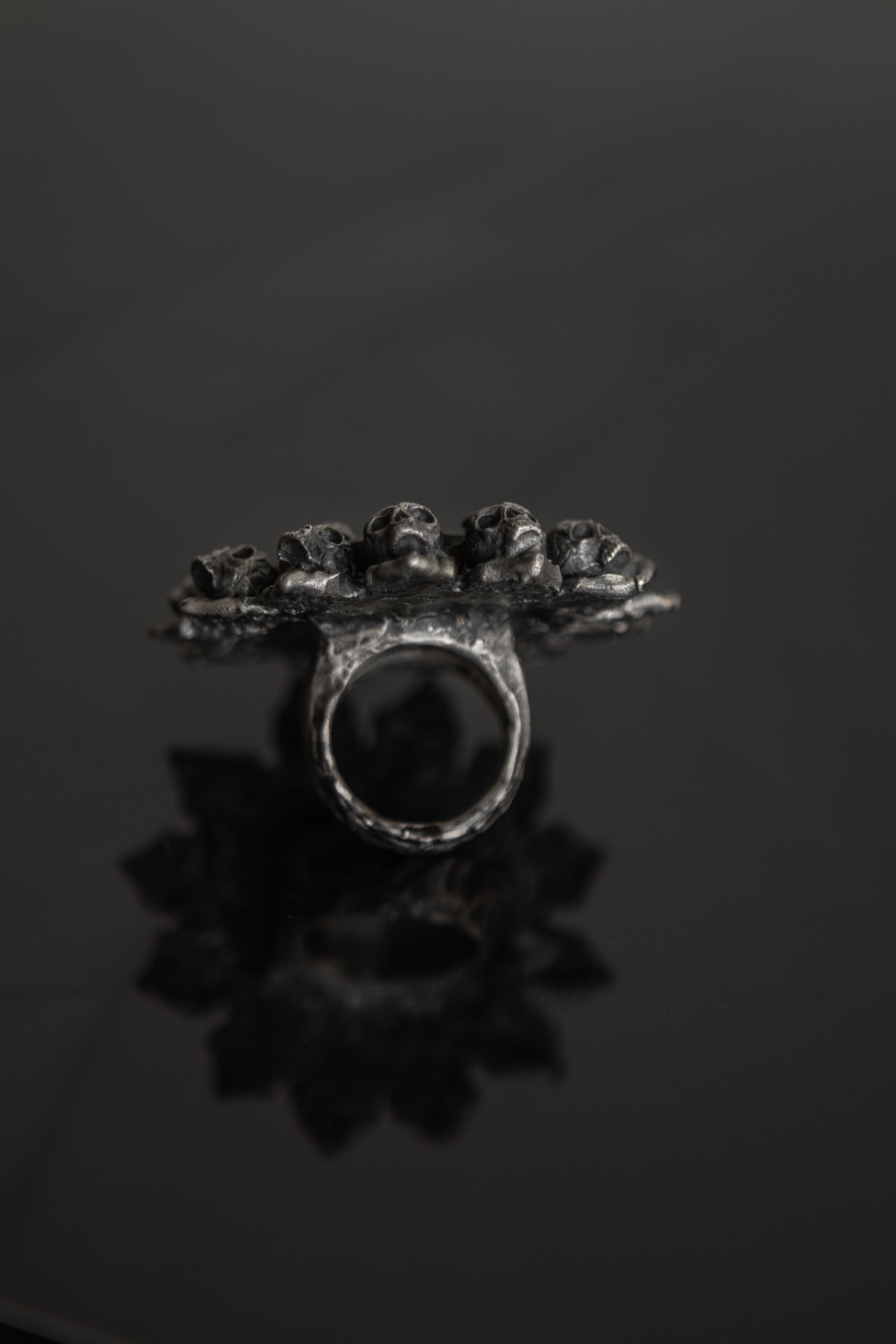 One-of-a-kind ring with skulls in a single copy